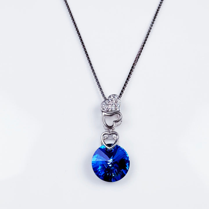 Silver blue circle stone heart pendant