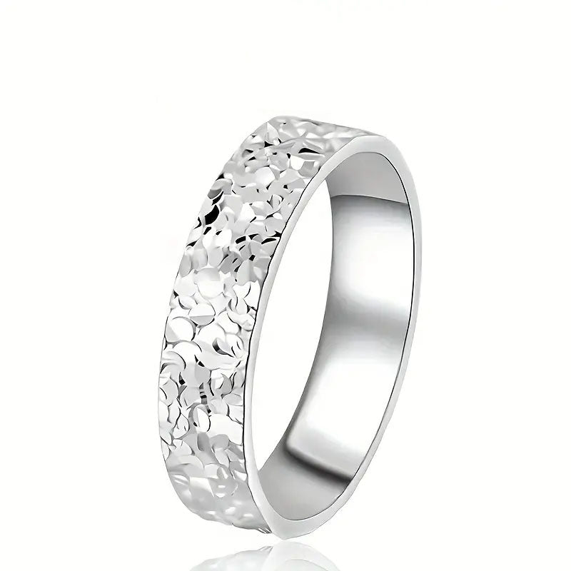 Silver uneven surface area ring