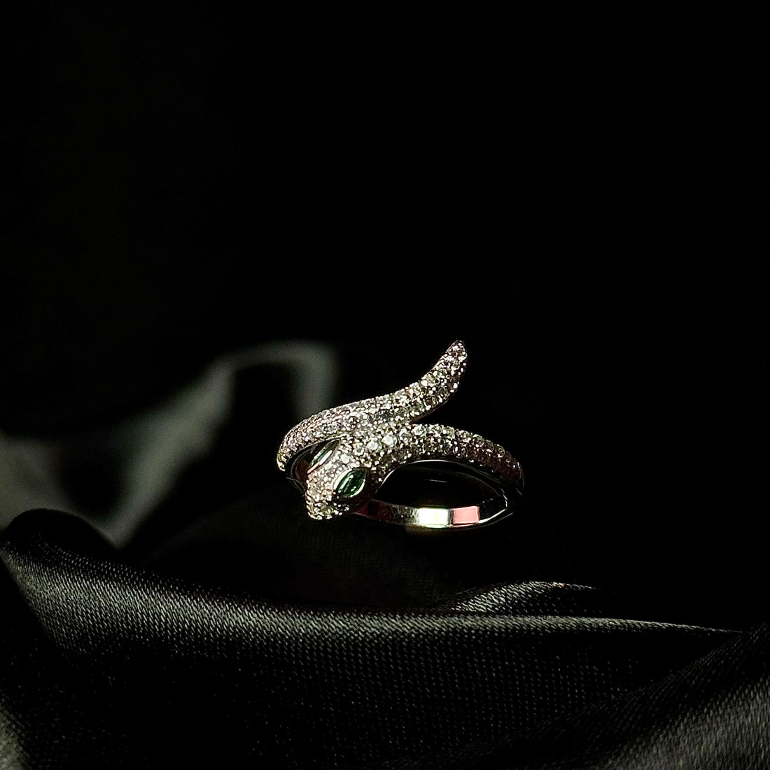 Silver iced out snake ring
